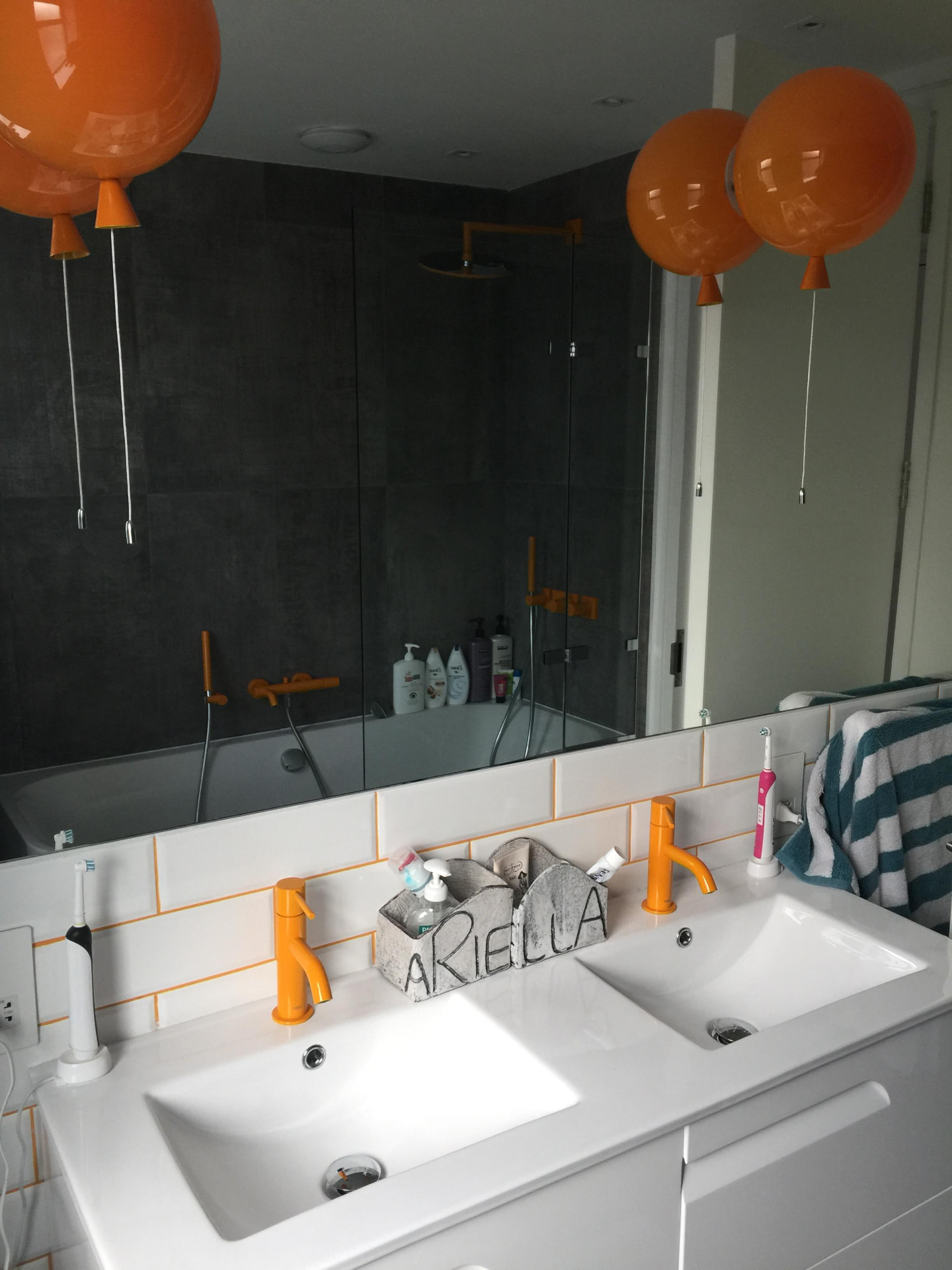 Family bathroom with twin basins, metro tiling and walk-in shower